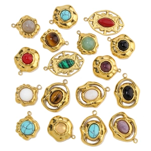 Flat lay of vintage gold pendants with turquoise, agate, and assorted semi-precious stones
