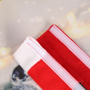 Christmas refrigerator door handle covers in festive red felt with white trim and velcro