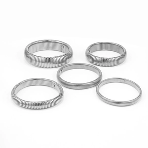 Detailed view of silver stainless steel stretch bracelets in five different width sizes