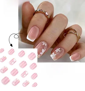 Short square press-on nails with pink and white French gradient and white floral patterns