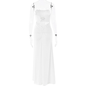 Detail of white backless dress featuring lace-up straps and ruched fabric texture