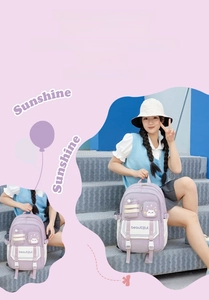 Detail of purple and beige student backpack with cute cat patch and functional pockets