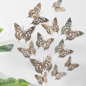 Detailed view of 3D cutout gold and silver butterfly wall stickers in varied sizes