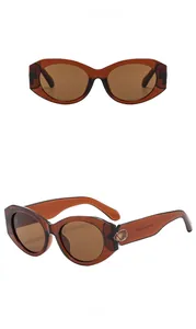 Dual view of retro cat-eye sunglasses with tea-colored frames and golden accents