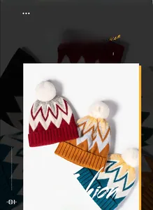 Close-up of winter knitted hats in red, yellow, and blue with white faux fur pom-poms