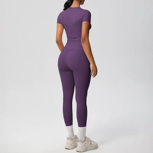Detail view of deep purple compression yoga set showing slim fit and back seam design