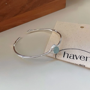 Irregular S925 silver open bangle with oval pale green gemstone in natural style