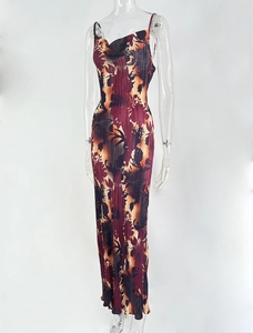 Detail of slim-fit pleated maxi dress with abstract floral print and spaghetti straps