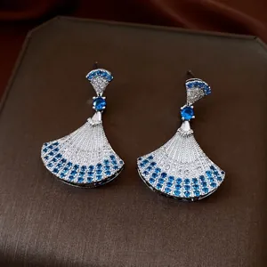 Elegant silver fan-shaped drop earrings featuring navy blue and white zircon pavé setting