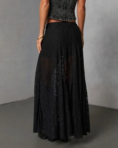 Close-up of black lace midi skirt showing intricate floral patterns and sheer texture detail