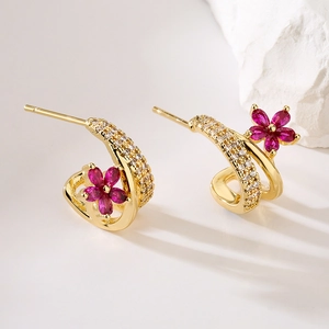 18K gold plated flower earrings with pink and clear zircon crystals on white rock