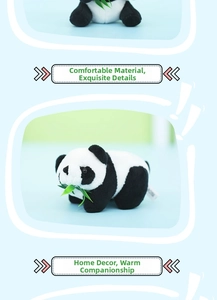 Close-up of panda plush toy with green bamboo leaf and soft faux fur texture