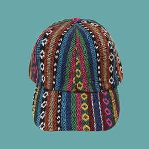 Close-up of ethnic style baseball cap featuring colorful woven fabric and geometric patterns