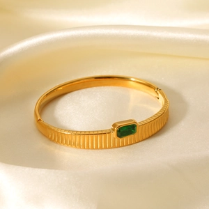 Vertical striped gold stainless steel bracelet with green zircon on satin fabric