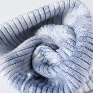 Winter tie-dye knit beanie in blue and white gradient rib-knit style for warmth