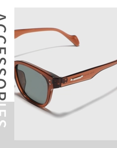 Detailed side view of vintage square sunglasses with tortoiseshell frame and metal rivets