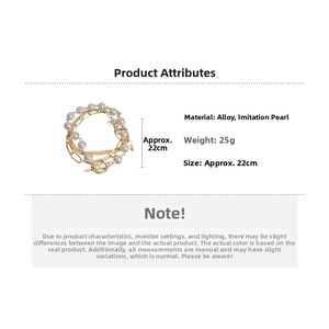Detail view of gold-layered alloy chain bracelet with white faux pearls and dimensions