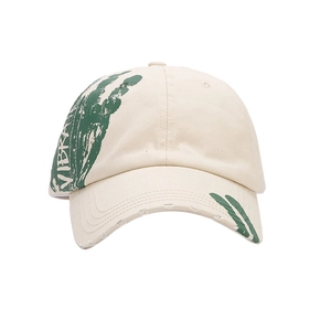 Beige cotton baseball cap with green graffiti prints and distressed brim details