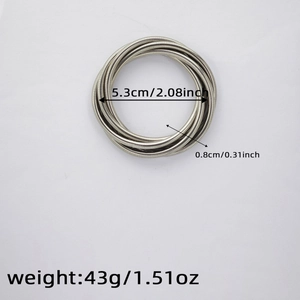 Detail view of multi-layer spiral silver bracelet with size and weight specifications