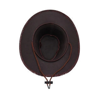 Detailed top view of a dark brown cowboy hat with leather texture brim and adjustable chin strap
