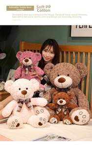 Detail of plush teddy bears with plaid bows and embroidered heart paw pads in a cozy setting