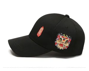 Detail of vibrant lion dance embroidery on a black street-style baseball cap