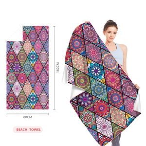 Detail view of colorful mandala beach towel measuring 80x160cm with microfiber fabric