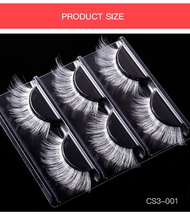 Close-up of five pairs of thick white faux mink eyelashes for stage makeup in a tray