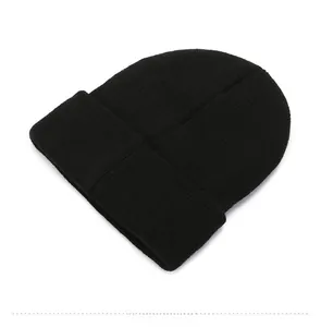 Detailed back view of a black knitted beanie showing elastic ribbed fabric texture