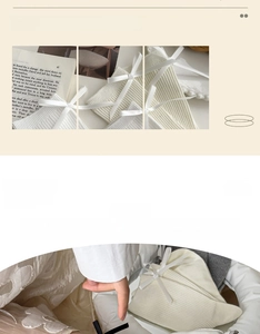 Detail of cream white ribbed mid-calf socks featuring a sweet satin bow decoration