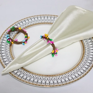 Handmade Easter napkin rings with colorful berries and rustic vine style for table decor