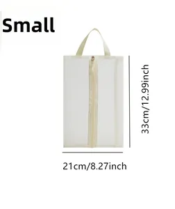Detail view of small white mesh travel shoe bag with zipper and handle, size 33x21cm