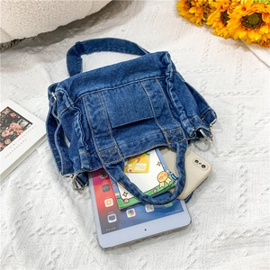 Top view of blue denim tote bag interior showing capacity for tablet and daily items