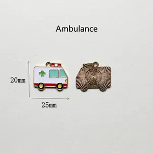 Detailed front and back views of an enamel ambulance charm with green medical cross