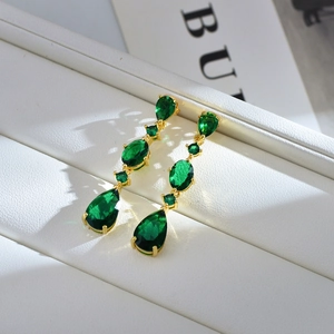 Luxurious emerald green teardrop crystal drop earrings with gold plated setting