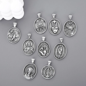 Collection of nine punk-style round pendants featuring religious icons in polished steel