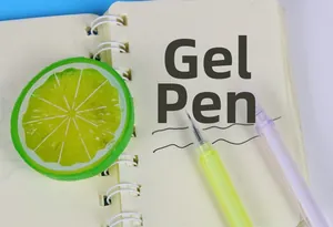 Detail view of colorful needle-tip pens showing precision writing on a notebook