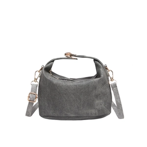Dark grey pleated canvas crossbody bucket bag with golden hardware on white background