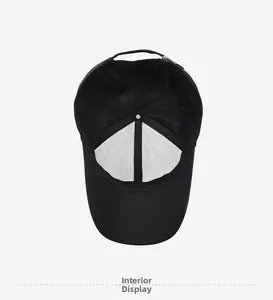 Interior view of black baseball cap showing breathable cotton fabric and adjustable strap