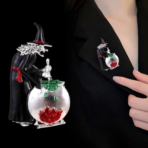 Halloween witch enamel brooch with cauldron and green potion on a black blazer lapel