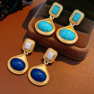 Vintage oval resin earrings with turquoise and navy stones in matte gold finish