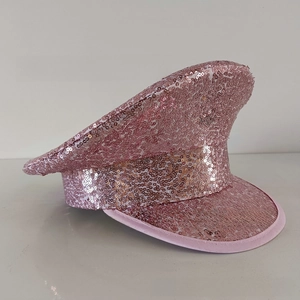 Detail view of pink sequin captain hat with sparkling texture for party and stage wear
