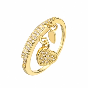 Gold plated open heart ring with sparkling cubic zirconia crystals on white background