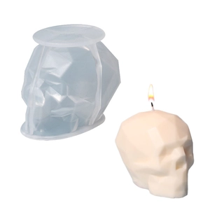3D geometric skull silicone mold shown with a burning candle for DIY handmade crafts