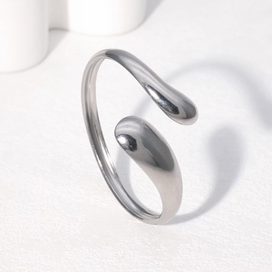 Polished silver stainless steel open bangle with unique organic fluid teardrop design
