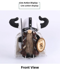 Front view of Viking gnome doll with horn helmet, braided beard, and wooden shield