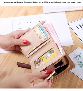 Detail view of large capacity beige wallet showing card slots and zipper compartment