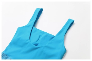 Close-up of wide shoulder straps and U-shaped neckline on sky blue pleated tennis dress