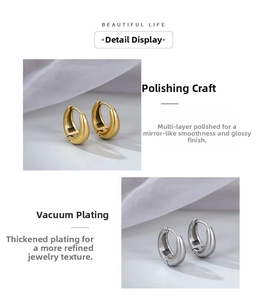 Detail of vacuum-plated C-shape hoop earrings with a high-polished mirror finish