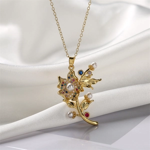 Golden flower tassel necklace with colorful cubic zirconia and pearl on white silk